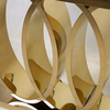 Close-up of the elegant circular design of the Luxury White and Gold Faux Marble Console Table.