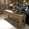 Luxury Stainless Steel Marble Entrance Table with a stunning brass design and decorative items on top.