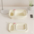 Portable Folding Baby Bath Basin – Lightweight Travel Wash Tub in light color with pink accents on a table.