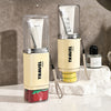 Plastic Travel Toothbrush Cup Portable Couple Set displaying two compact toothbrush holders on a marble surface.