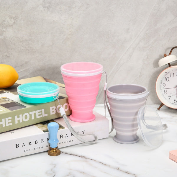 Portable Collapsible Silicone Travel Cup set in pink, gray, and blue, showcasing their convenience and portability.