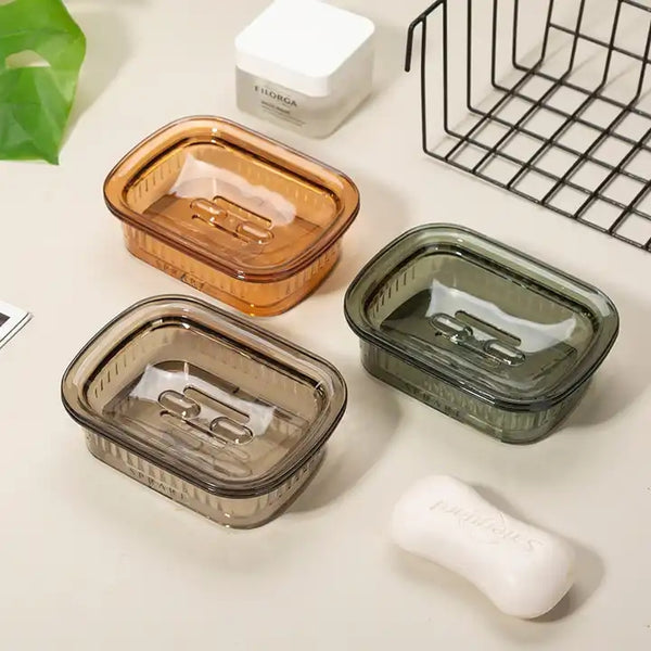 Portable Eco-Friendly Soap Tray in three colors: amber, gray, and green, showcasing effective soap drainage.