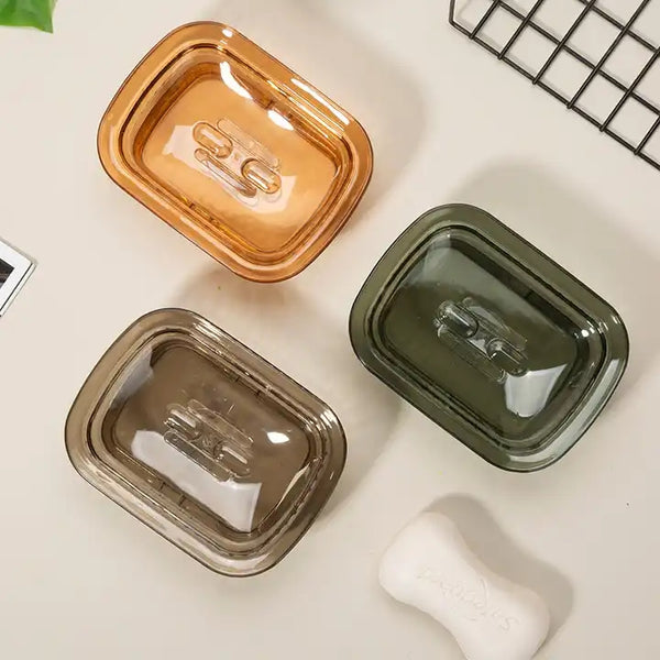 Portable Eco-Friendly Soap Tray in brown, green, and orange colors for drying soap and preventing mess.