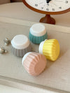 Portable travel silicone bottle set in pastel colors on display, perfect for travel toiletries.