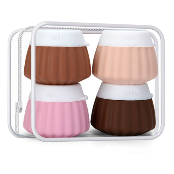 Portable travel silicone bottle set with four colorful bottles in a container, ideal for toiletries and travel.