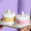 Portable LED Cake Desk Lamp displayed on a tray with playful birthday cake design and colorful decorations.