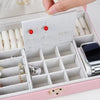Premium Multi-Compartment Jewelry Box with organized compartments for rings, earrings, and watches.