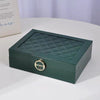 Premium Multi-Compartment Jewelry Box with a quilted green design and a lock for secure storage.