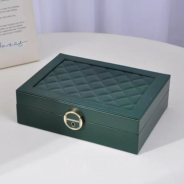 Premium Multi-Compartment Jewelry Box with a quilted green design and a lock for secure storage.