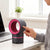 USB Mosquito Killer Lamp with UV Suction Fan Trap in use beside a laptop on a desk.