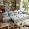 4 Seater Modular Fabric Sectional Sofa in a cozy living room setting with a fireplace.