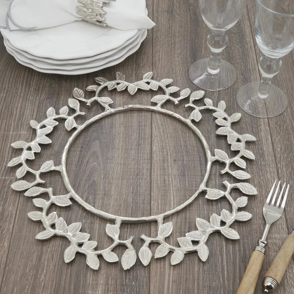 Stainless Steel Charger Plate artfully designed with leaf accents, perfect for elegant dining settings.