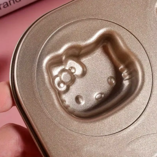 Close-up of Cartoon Character Non-Stick Baking Pan featuring a Hello Kitty design for themed baking.