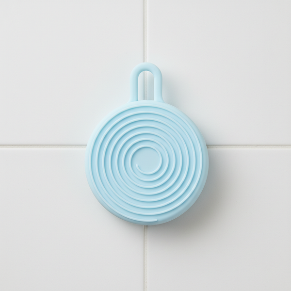 Silicone Care Hair Silicone Scalp Massager in blue circular design for effective scalp exfoliation and stimulation.