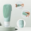 Silicone refillable shampoo lotion bottles in mint green with squeeze feature for travel and convenience.