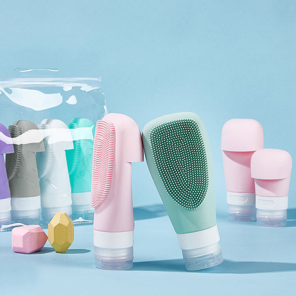 Silicone refillable shampoo lotion bottles in various colors, travel-friendly and organized for personal care.