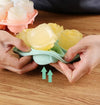 Hands holding Silicone Rose Shaped Ice Cube Tray with rose-shaped ice cubes, demonstrating easy release functionality.