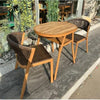 Space-Saving 3-Piece Outdoor Dining Set on a patio with two stylish chairs and a round table.
