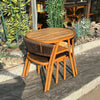 Space-Saving 3-Piece Outdoor Dining Set featuring a compact table and stacked chairs, ideal for small spaces.