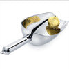 Stainless Steel Ice Scoop with golden foil-wrapped food, ideal for ice and dessert serving in kitchens or bars.