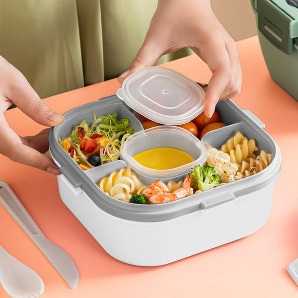 Stylish Two-Tier Airtight Lunch Box with compartments for salads, pasta, and sauces, held by hands on a vibrant background.