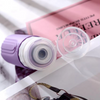 Travel Silicone Lotion Bottles in purple with open cap on a magazine, perfect for travel and leak-proof storage.