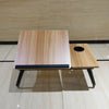 Folding Laptop Bed Desk with Cup Holder shown in a wood finish, ideal for comfortable workspace on sofa or bed.
