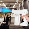 DS350 Handhold 800ML Spray Gun in use, spraying sanitizer in an office setting.