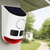 Solar Garden Light Motion Sensor Alarm mounted on a house, featuring a solar panel and a red flashing light for security.