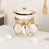 Ceramic Soup Tureen Set with Bowls and Spoons, elegantly displayed with a gold holder and accessories.
