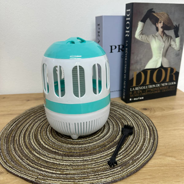 UV LED 365nm Mosquito Killer Trap on a wooden surface with books in the background, designed for pest control.