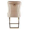 Velvet Dinner Chair with Gold Accents showcasing a luxurious design and gold ring detail at the back.