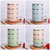 Wholesale Portable Lunch Box Insulation in various colors stacked vertically on a wooden cutting board.
