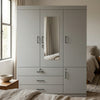 4-Door Grey Wardrobe with Mirror and Drawers featuring sleek design and storage drawers.