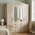 4-Door Mirrored Bedroom Wardrobe with Drawers in a stylish bedroom setting, featuring drawers and full-length mirrors.