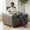 Grey Modern Accent Armchair in a living space, showcasing its contemporary design and comfortable seating.