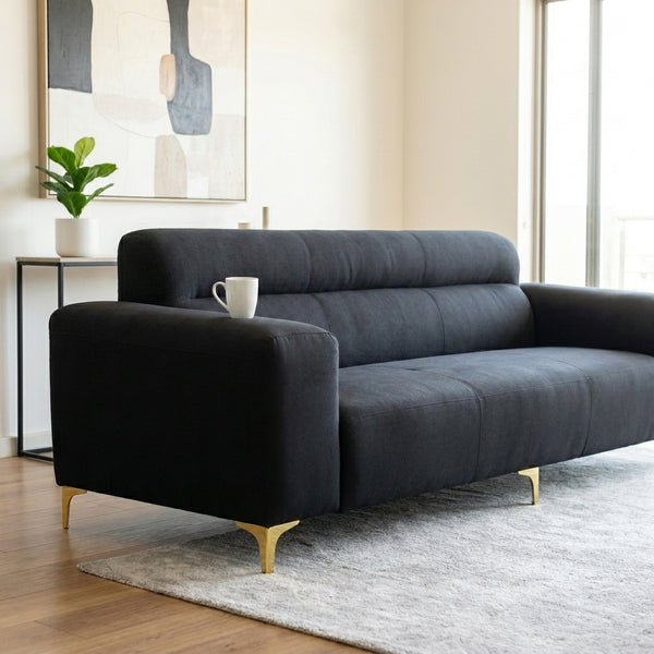 Modern Black 3-Seater Sofa with Gold Metal Legs in a stylish living room setting.