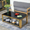 Designer Coffee Table with black surface and gold accents, serving as a stylish centerpiece in a modern living room.