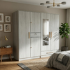 4-Door Wood Grain Wardrobe with Mirror and Gold Handles in a modern bedroom setting.