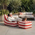 Red and White Striped Outdoor Bean Bag Lounger with matching ottoman in a stylish outdoor setting.