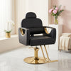 Reclining Hydraulic Salon Styling Chair in black leather with gold accents, perfect for professional beauty treatments.