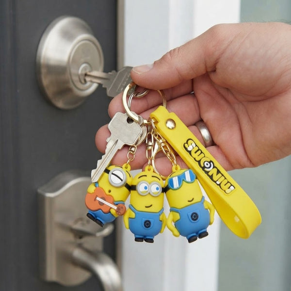 3D Rubber Cartoon Character Keychain with colorful Minions design attached to keys in hand.