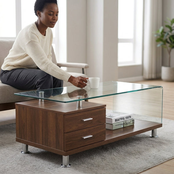 Woman enjoying a cup of coffee at the Glass Top Coffee Table with Drawers in a modern living room.