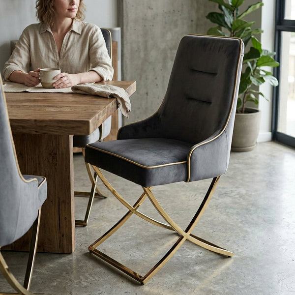 Modern Elegant Upholstered Dining Chair with sleek design next to a wooden table and a woman enjoying coffee.
