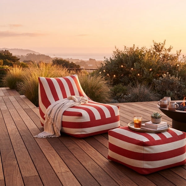 Red and White Striped Outdoor Bean Bag Lounger on a wooden deck during sunset.
