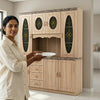 Woman holding a plate in front of a minimalist glass kitchen cabinet shutter door, showcasing modern design and elegance.