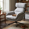 Lamach Lounge Chair in gray fabric with high-back support, placed in a cozy living room setting.