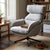 Lamach Lounge Chair in gray fabric with high-back support, placed in a cozy living room setting.