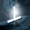 Portable Solar LED Emergency Light System arranged in a triangular shape on a rocky surface with soft lighting.