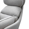 Close-up view of the soft cushioning of the Lamach Lounge Chair in a modern gray fabric.